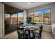 Cozy breakfast nook features a round table, backyard views, and sliding doors to the outdoor patio at 2544 W Pumpkin Ridge Dr, Anthem, AZ 85086