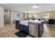 Bright and airy kitchen with a large island featuring a farmhouse sink and stainless steel dishwasher at 2544 W Pumpkin Ridge Dr, Anthem, AZ 85086