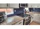 Close-up of a modern kitchen boasting granite countertops and stainless steel appliances at 2544 W Pumpkin Ridge Dr, Anthem, AZ 85086