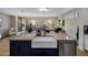 Open-concept kitchen with a large island, stainless steel appliances, and seamless flow into the living area at 2544 W Pumpkin Ridge Dr, Anthem, AZ 85086