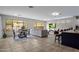 Open living area with tile floors, a cozy couch, media center, and breakfast nook seating four at 2544 W Pumpkin Ridge Dr, Anthem, AZ 85086