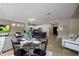 Open-concept living space with dining area, kitchen, and comfortable seating, creating an inviting atmosphere at 2544 W Pumpkin Ridge Dr, Anthem, AZ 85086