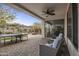 Covered patio with ceiling fan, ping pong table, and comfortable seating, perfect for outdoor entertainment at 2544 W Pumpkin Ridge Dr, Anthem, AZ 85086