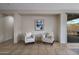 Cozy seating area featuring neutral tones, comfortable armchairs, and elegant decor at 2544 W Pumpkin Ridge Dr, Anthem, AZ 85086