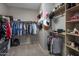 Spacious walk-in closet with organized shelving and plenty of storage space at 2544 W Pumpkin Ridge Dr, Anthem, AZ 85086