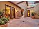 Idyllic courtyard featuring a stone fountain, potted plants, and elegant architecture for a serene outdoor living space at 28689 N 67Th Dr, Peoria, AZ 85383