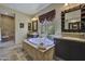 Luxurious bathroom featuring a soaking tub, tile flooring, and and vanities at 28689 N 67Th Dr, Peoria, AZ 85383
