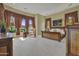 Large bedroom with plush carpeting and abundant natural light through draped windows at 28689 N 67Th Dr, Peoria, AZ 85383