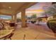 Expansive outdoor patio with seating, water features, pool, and well-maintained landscaping at 28689 N 67Th Dr, Peoria, AZ 85383