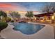 Inviting pool area features a rock waterfall, grotto, and outdoor seating area at 28689 N 67Th Dr, Peoria, AZ 85383