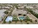 Backyard oasis featuring a sparkling pool, basketball court, trampoline, and covered patio offers endless opportunities for recreation at 3314 E Kael St, Mesa, AZ 85213