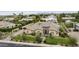 Stunning aerial view of a custom home with well-manicured landscaping, a circular entryway, and a large driveway at 3314 E Kael St, Mesa, AZ 85213
