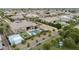 Gathering-friendly backyard boasts a pool, sports court, playground, and cozy cabana, perfect for outdoor entertaining and active living at 3314 E Kael St, Mesa, AZ 85213