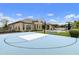 A vast backyard with a basketball court, trampoline and pool offers endless opportunities for outdoor fun and relaxation at 3314 E Kael St, Mesa, AZ 85213