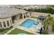 Spectacular backyard features a luxurious pool, jacuzzi, covered patio, and outdoor grill area, perfect for entertaining guests in style at 3314 E Kael St, Mesa, AZ 85213