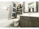 Bathroom featuring a shower-tub combo, a ladder shelf for storage and stylish fixtures at 3314 E Kael St, Mesa, AZ 85213