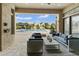 Inviting covered patio featuring comfortable seating, elegant decor, and a serene view of the pool area at 3314 E Kael St, Mesa, AZ 85213
