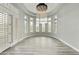 Elegant dining room with a decorative chandelier and lots of natural light at 3314 E Kael St, Mesa, AZ 85213