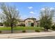 Lovely home with lush green lawn and mature trees at 3314 E Kael St, Mesa, AZ 85213