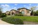 Charming home with a well-manicured lawn and desert landscaping, creating an inviting curb appeal at 3314 E Kael St, Mesa, AZ 85213