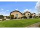 A well-maintained lawn, desert landscaping, and an oversized brick-paved driveway lead to this charming home at 3314 E Kael St, Mesa, AZ 85213