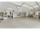 Spacious garage with epoxy flooring and ample storage cabinets at 3314 E Kael St, Mesa, AZ 85213