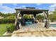 Relaxing gazebo by the pool features comfortable seating and stylish decor in private backyard at 3314 E Kael St, Mesa, AZ 85213