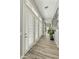 Long hallway with wood floors and lots of natural light at 3314 E Kael St, Mesa, AZ 85213
