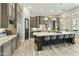 Well-lit kitchen with stainless steel appliances, a large island, and ample cabinet space at 3314 E Kael St, Mesa, AZ 85213