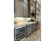 Kitchen with beverage cooler, stainless steel refrigerator, and custom cabinets at 3314 E Kael St, Mesa, AZ 85213
