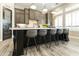 Kitchen island with counter seating, offering a perfect spot for casual meals and gatherings at 3314 E Kael St, Mesa, AZ 85213
