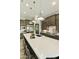 Spacious kitchen with a large island, pendant lighting, and stainless steel appliances at 3314 E Kael St, Mesa, AZ 85213