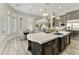 Open kitchen featuring stainless steel appliances, a large center island, and adjacent dining area at 3314 E Kael St, Mesa, AZ 85213