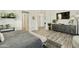 Bright and airy main bedroom showcases modern furniture and a neutral color palette at 3314 E Kael St, Mesa, AZ 85213