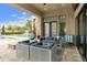Relaxing covered patio with stylish furniture and view of pool, perfect for enjoying outdoor living at 3314 E Kael St, Mesa, AZ 85213