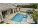 Backyard with a pool, spa, outdoor kitchen, and gazebo at 3314 E Kael St, Mesa, AZ 85213