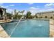 A refreshing pool with a cascading water feature and poolside lounging promises hours of relaxation under the sun at 3314 E Kael St, Mesa, AZ 85213