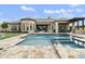 Backyard pool area featuring a spa, water features, patio and a covered area at 3314 E Kael St, Mesa, AZ 85213