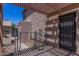 Exterior shot of a covered patio area featuring a dog run, and a security door at 3397 E Derringer Way, Gilbert, AZ 85297