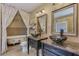 Elegant bathroom with dual sinks, marble countertops, and a clawfoot tub at 3397 E Derringer Way, Gilbert, AZ 85297