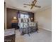 Comfortable bedroom featuring two windows and cozy carpeting at 3397 E Derringer Way, Gilbert, AZ 85297