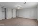 Bedroom with neutral carpet, ceiling fan, and large closet with sliding doors at 3397 E Derringer Way, Gilbert, AZ 85297