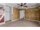 Bedroom featuring a ceiling fan and a view into a closet with shelving at 3397 E Derringer Way, Gilbert, AZ 85297
