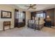 Comfortable bedroom featuring two windows and cozy carpeting at 3397 E Derringer Way, Gilbert, AZ 85297