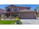 Charming two-story home with a well-manicured lawn and inviting front porch at 3397 E Derringer Way, Gilbert, AZ 85297
