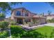 Charming two-story home with a well-manicured lawn and inviting front patio at 3397 E Derringer Way, Gilbert, AZ 85297