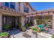Inviting front patio featuring comfortable seating, lush greenery, and a welcoming atmosphere at 3397 E Derringer Way, Gilbert, AZ 85297