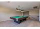 Spacious game room with a billiards table, staircase access, and recessed lighting creating an inviting entertainment space at 3397 E Derringer Way, Gilbert, AZ 85297