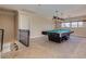 Spacious game room with a billiards table, staircase access, and recessed lighting creating an inviting entertainment space at 3397 E Derringer Way, Gilbert, AZ 85297