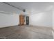 Spacious garage with ample storage, finished walls, and a visible garage door mechanism at 3397 E Derringer Way, Gilbert, AZ 85297
